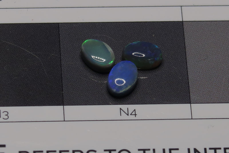 1.40Cts Lightning Ridge Black Polished Opals, 3 Stones, Greens And Blues. - Australian Opal Store